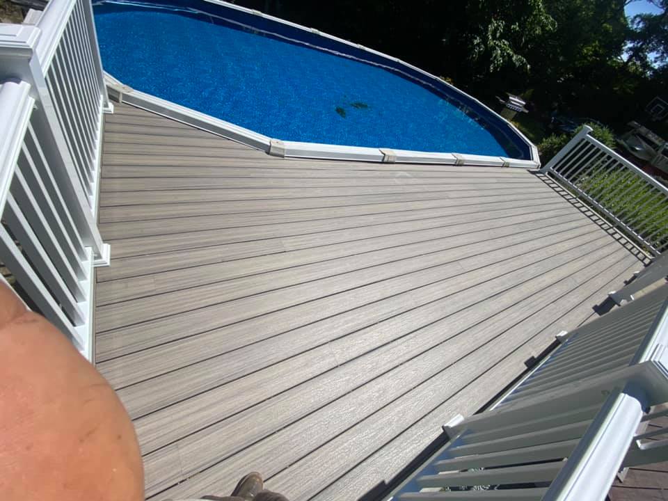 View of custom pool deck surround with brown surface