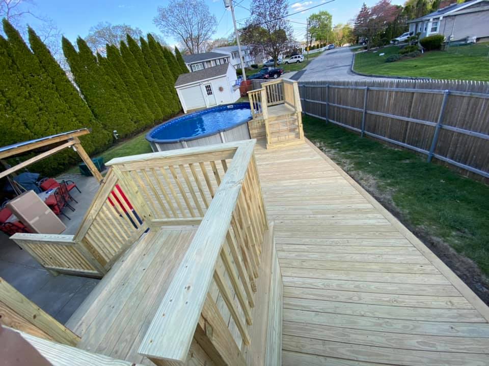 Custom deck for surrounding above ground pool unfinished wood